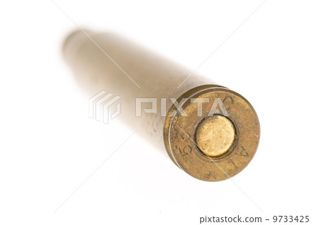 Empty shell casing against gradient 9733425