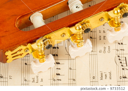 Old music sheet and a guitar Old music sheet and a guitar 9733512
