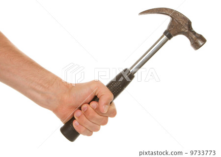 Man holding a old metal hammer 9733773