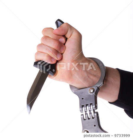 Male with a sharp knife in it's hand with a handcuff 9733999