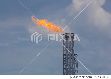 Burning oil gas flare during sunset Burning oil gas flare during sunset 9734012