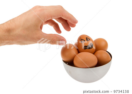 Scared egg, waiting to be grabbed by a hand Scared egg, waiting to be grabbed by a hand 9734138