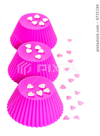Pink silicone baking cups. Isolated on white background Pink silicone baking cups. Isolated on white background 9735194