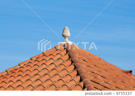 Small statue on the red roof Small statue on the red roof 9735337