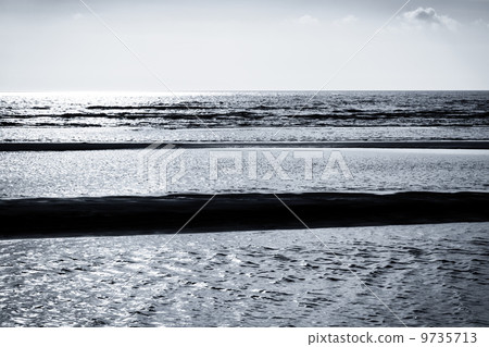 beautiful sunset on the beach in black and white 9735713