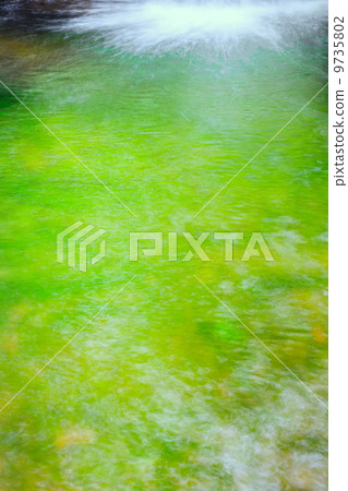 A mountain stream with fresh greenery A mountain stream with fresh greenery 9735802