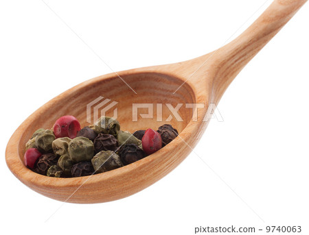 Pepper seasoning  mix in wooden spoon isolated on white backgrou 9740063