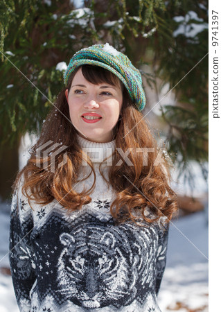 Beautiful young woman  wearing a cap 9741397