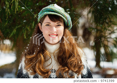 Beautiful young woman  wearing a cap 9741399