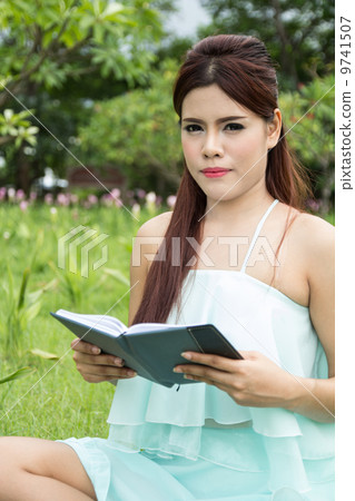 Young woman reading a book 9741507