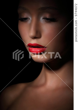 Accent. Highlight. Glamorous Exotic Asian Woman in Shadows. Evening Makeup 9744872