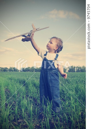 children with airplan toy outdoors 9745704