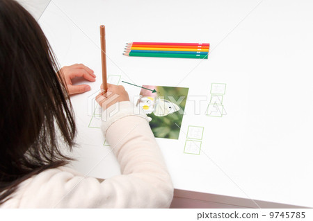 Girl studying Hiragana 9745785