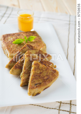 Martabak or murtabak, also mutabbaq, is a stuffed pancake is com 9750656