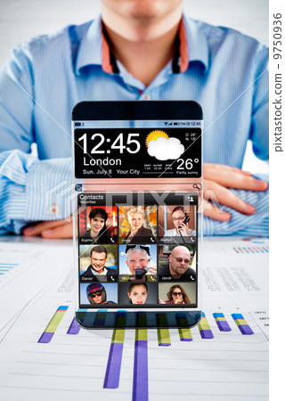 Smartphone with transparent screen in human hands. 9750936