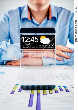 Smartphone with transparent screen in human hands. Smartphone with transparent screen in human hands. 9751635