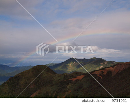 Mountain and rainbow 9751931