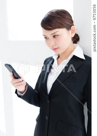 Business woman hitting e-mail 9753056