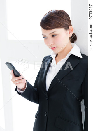 Business woman hitting e-mail 9753057