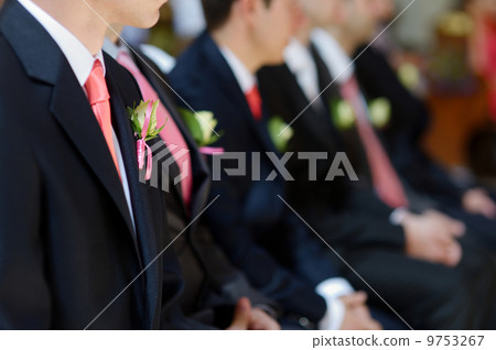 Wedding boutonniere on jacket of groom's man 9753267