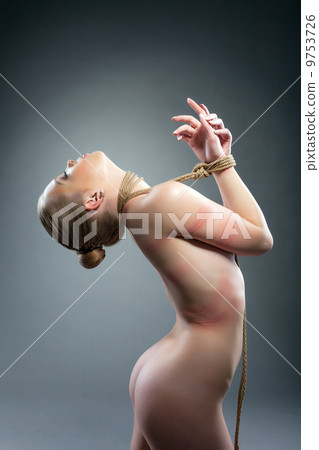 Naked girl with rope around her neck and hands 9753726