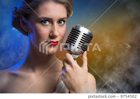 attractive female singer with microphone attractive female singer with microphone 9754502