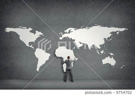 businessman attaches to the wall of the continents businessman attaches to the wall of the continents 9754702