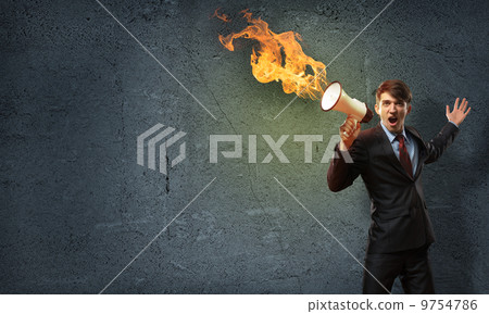 businessman shouting into a megaphone businessman shouting into a megaphone 9754786