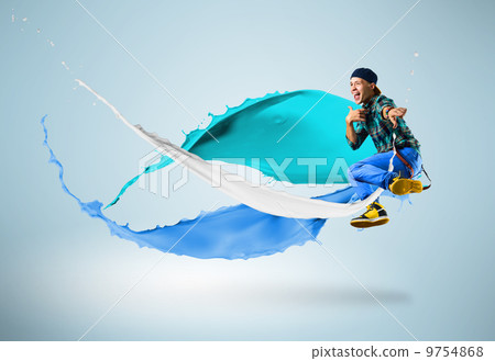 young male dancer jumping with splash of paint young male dancer jumping with splash of paint 9754868