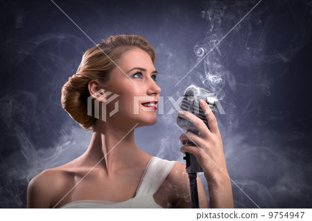 beautiful blonde woman singer with a microphone beautiful blonde woman singer with a microphone 9754947