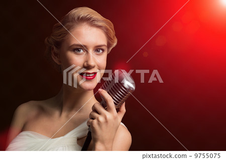 attractive female singer with microphone 9755075
