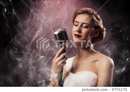 beautiful blonde woman singer with a microphone beautiful blonde woman singer with a microphone 9755278