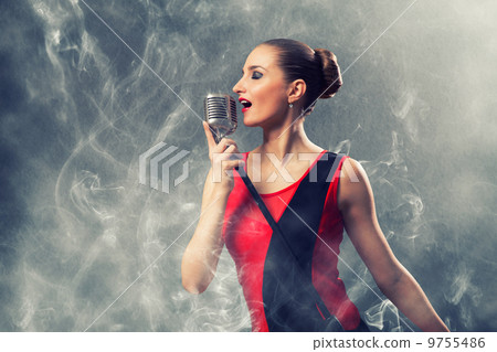 beautiful blonde woman singer with a microphone beautiful blonde woman singer with a microphone 9755486
