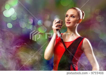 attractive female singer with microphone attractive female singer with microphone 9755488