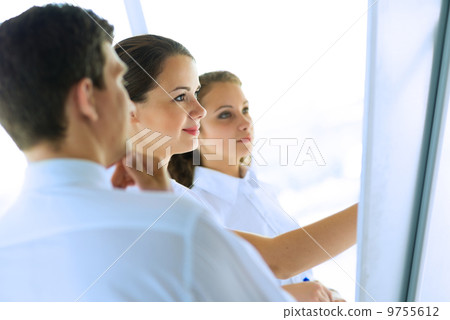 businessmen are meeting near the flipchart businessmen are meeting near the flipchart 9755612