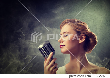 beautiful blonde woman singer with a microphone beautiful blonde woman singer with a microphone 9755928
