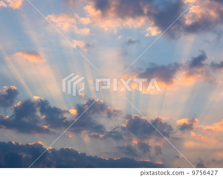 sunlight rays through clouds at sunrise sunlight rays through clouds at sunrise 9756427