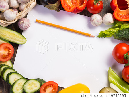 Vegetables tiled around a sheet of paper 9756595
