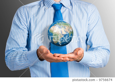 businessman holds up a planet Earth businessman holds up a planet Earth 9756674