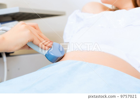 close-up of hands and abdominal ultrasound scanner close-up of hands and abdominal ultrasound scanner 9757021