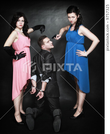 Two elegant women with gun gangster in handcuffs 9757325