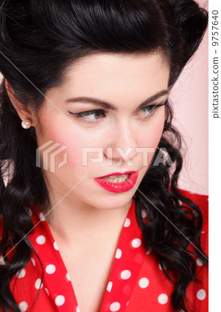 Close up woman with pinup makeup hairstyle Close up woman with pinup makeup hairstyle 9757640