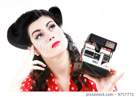 Pensive pretty retro girl with vintage camera Pensive pretty retro girl with vintage camera 9757772
