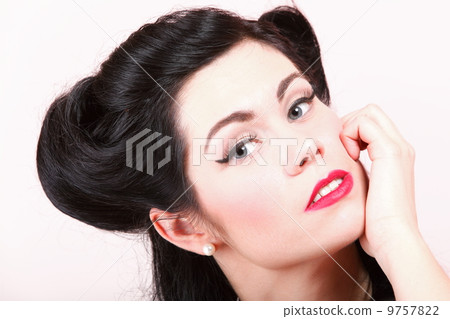 Portrait of pin-up girl with make-up and hairstyle Portrait of pin-up girl with make-up and hairstyle 9757822