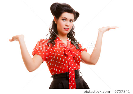 Retro pin-up girl young woman shrugging her sholders isolated 9757841