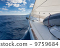 Anchor and furling drum on the yacht bow in sea 9759684