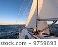 Sailboat during the regatta at sunset ocean 9759693