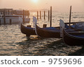 Venetian gondolas at sunrise in Venice 9759696