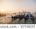 Venetian gondolas at sunrise in venice 9759697