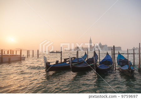 Venetian gondolas at sunrise in venice 9759697